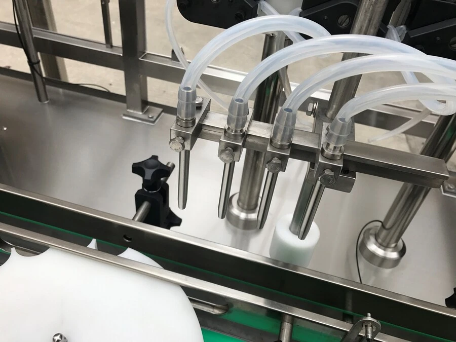 Máy Rửa và Chiết Rót Chai Tự Động 4 Vòi Bơm Nhu Động
